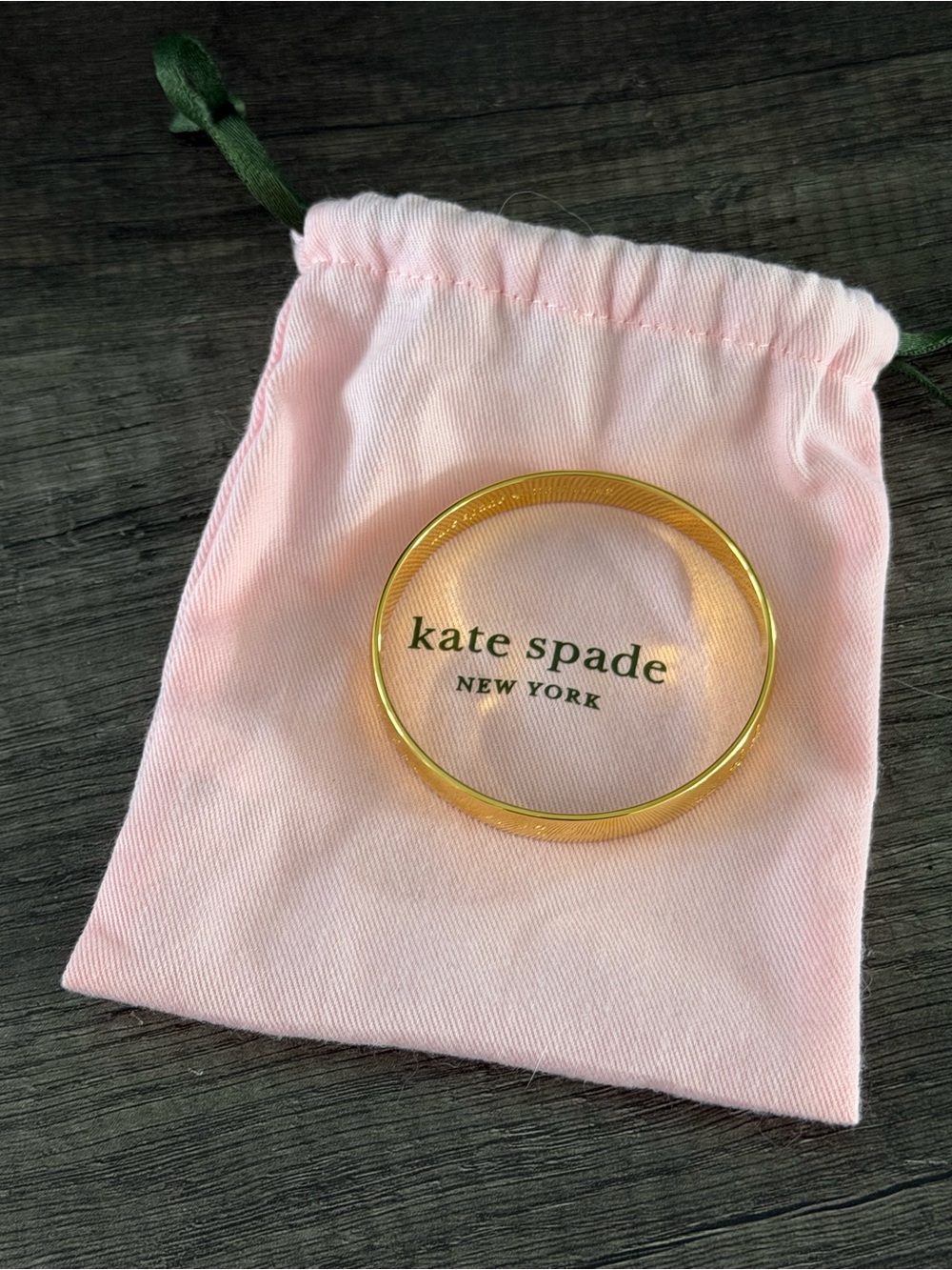 kate spade Gold Bangle with Pink Drawstring Pouch